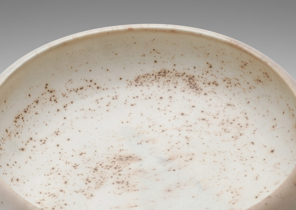 Gallery BAC considered organically modeled form in ivory with buff tones and brown speckling