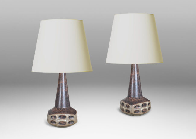 Gallery BAC organically modeled low square form with reliefs of ovals and a tall conical neck, in sponged matte dark and light brown tone glazes