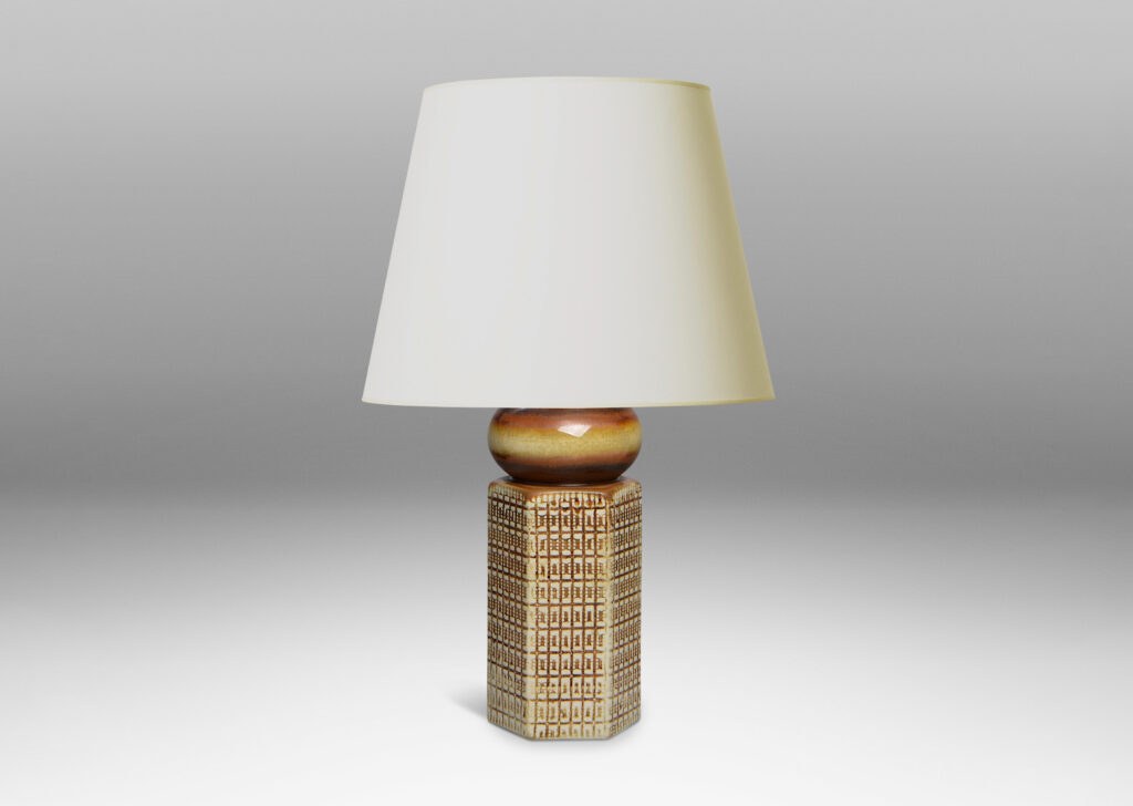 Gallery BAC hexagonal form ornamented with a gridded pattern, topped with a bulb-form cap glazed in warm brown over ivory