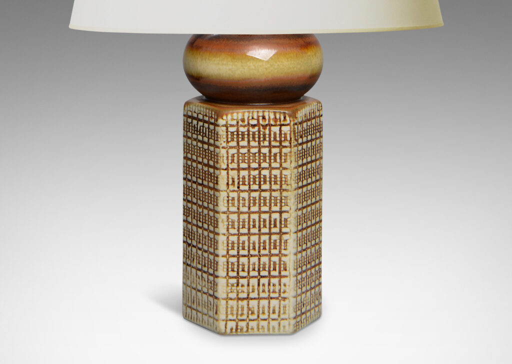 Gallery BAC hexagonal form ornamented with a gridded pattern, topped with a bulb-form cap glazed in warm brown over ivory