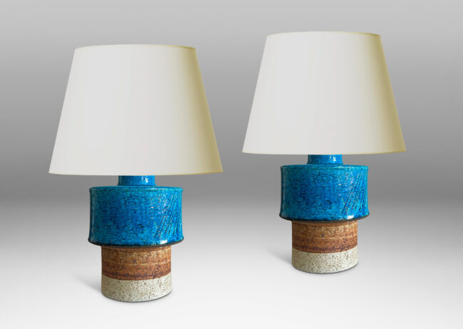 Gallery BAC stacked drum forms with a rustic grog texture, partially glazed in gloss turquoise, with matte brown accents