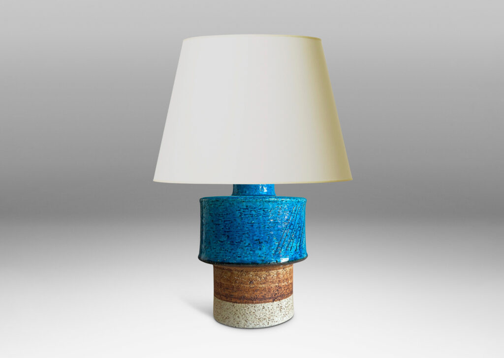 Gallery BAC stacked drum forms with a rustic grog texture, partially glazed in gloss turquoise, with matte brown accents