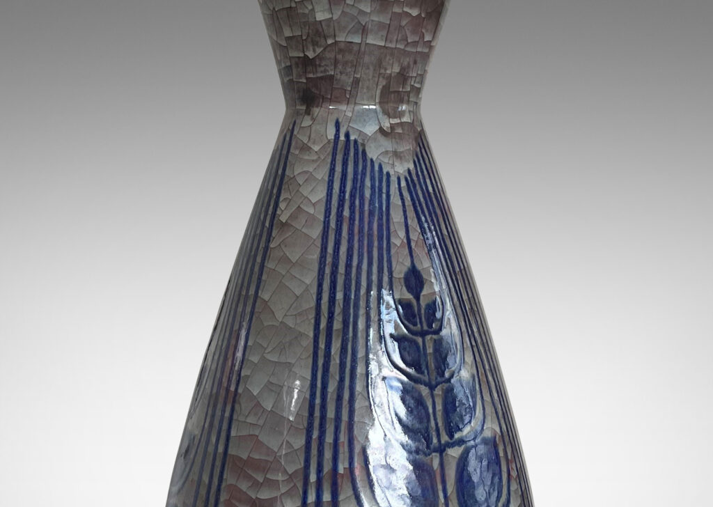 Gallery BAC tall ovoid form with flared neck, glazed in oyster shell craquel luster with hand-painted blue stylized foliate forms