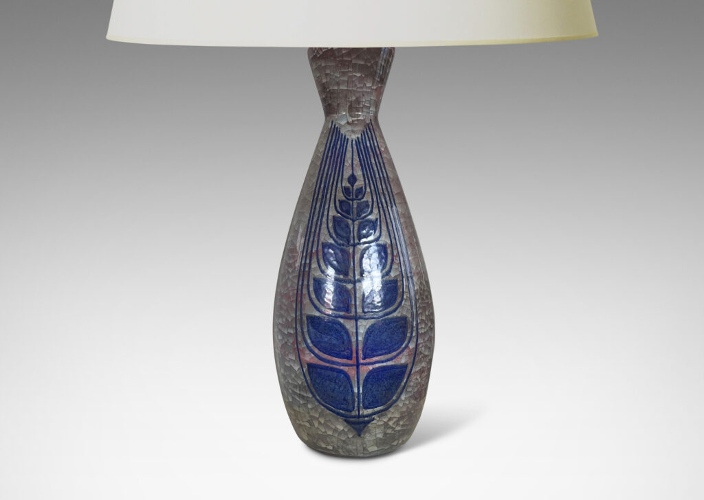 Gallery BAC tall ovoid form with flared neck, glazed in oyster shell craquel luster with hand-painted blue stylized foliate forms