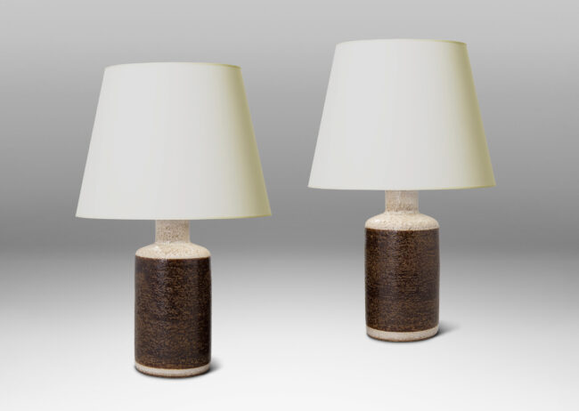 Gallery BAC cylindrical forms with recessed necks in a toothy surface texture with ivory and brown glazing