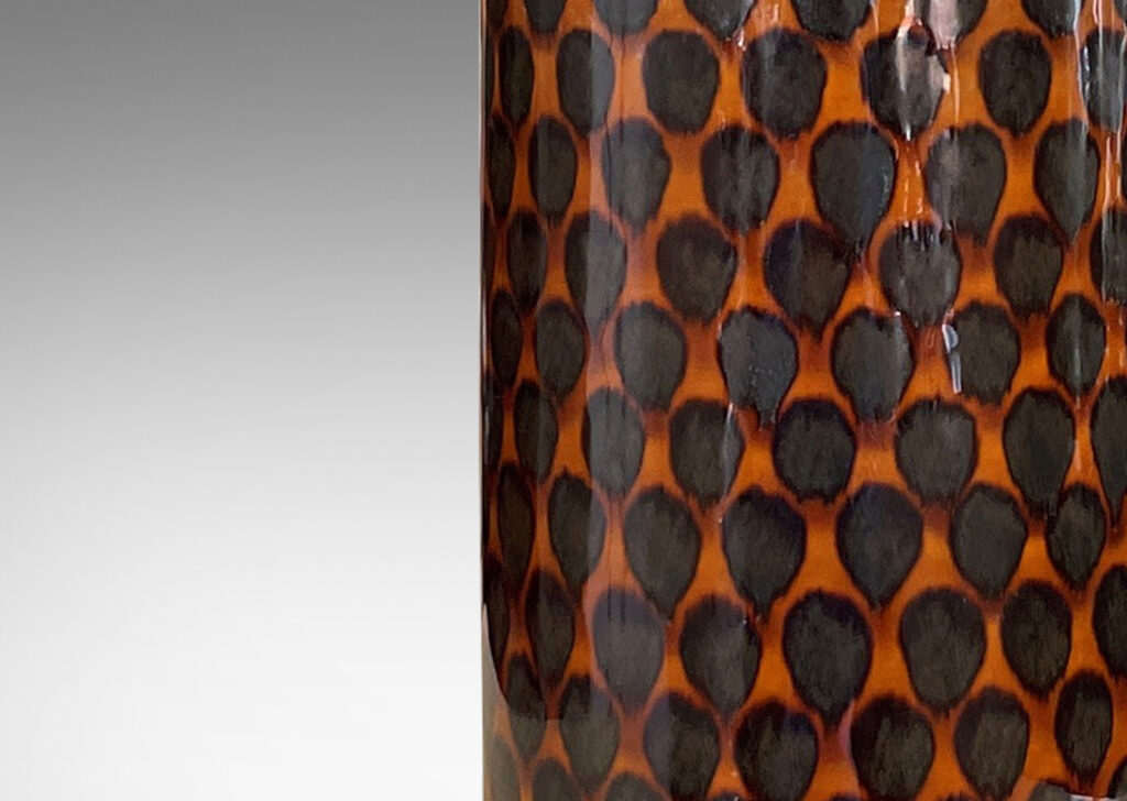 Gallery BAC cylindrical form with conical neck glazed in a shiny brown with pattern of dots arranged in a quincunx in a darker brown