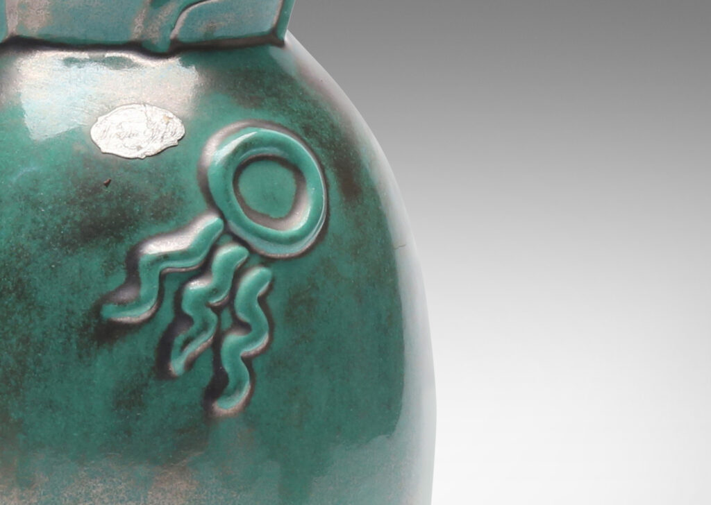 Gallery BAC tall ovoid form with flared mouth, ornamented with wave, sun and boat motifs,