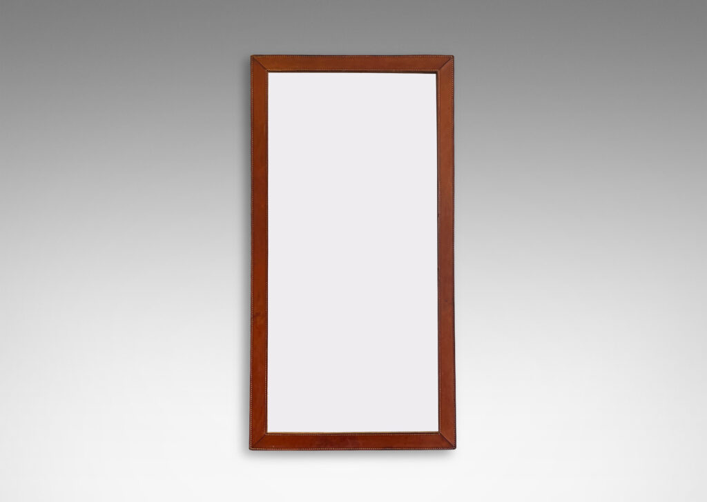 Gallery BAC frame of stitched stacked leather around a tall rectangular looking glass