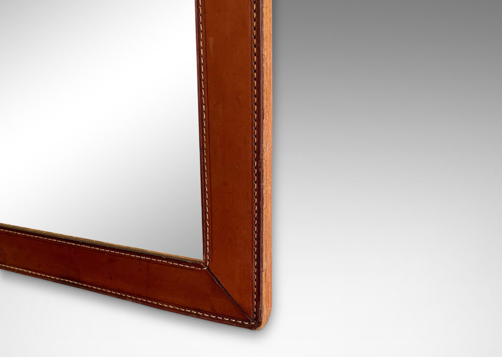 Gallery BAC frame of stitched stacked leather around a tall rectangular looking glass