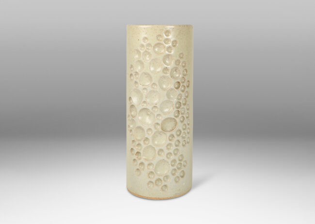 Gallery BAC tall cylindrical form decorated with carved constellation of circles in pale greige