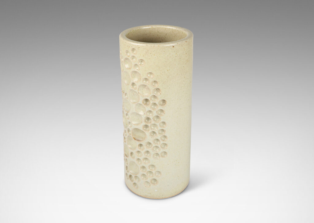 Gallery BAC tall cylindrical form decorated with carved constellation of circles in pale greige