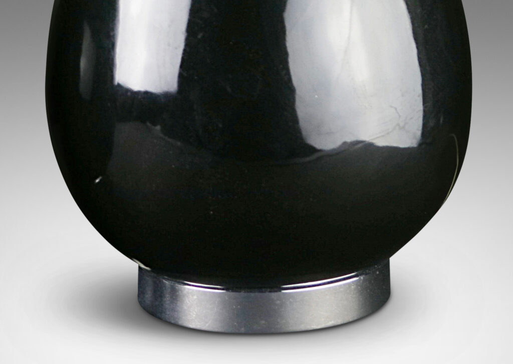 Gallery BAC ovoid forms in black opaline glass, with steel plinths and stands