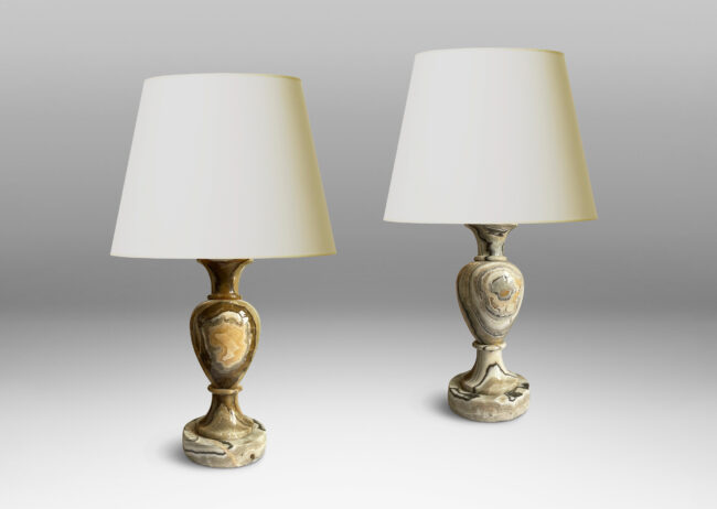 Gallery BAC baluster forms on disk plinths in handsomely veined onyx in taupe, tan, gray and ivory