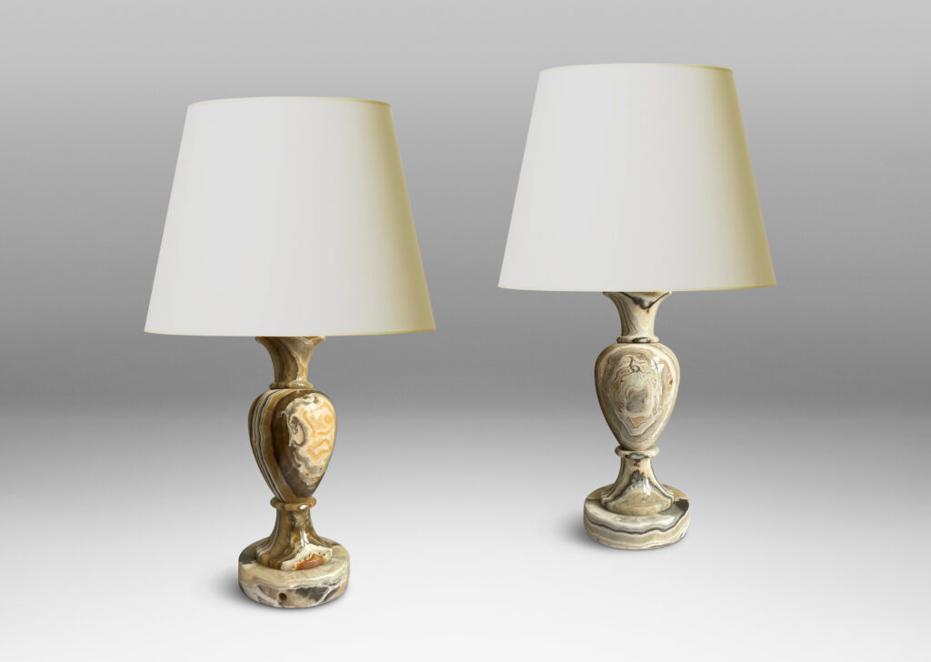 Gallery BAC baluster forms on disk plinths in handsomely veined onyx in taupe, tan, gray and ivory