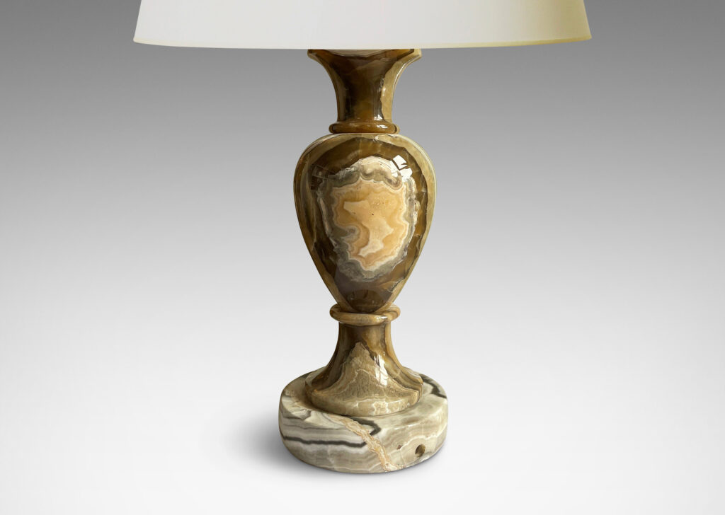 Gallery BAC baluster forms on disk plinths in handsomely veined onyx in taupe, tan, gray and ivory