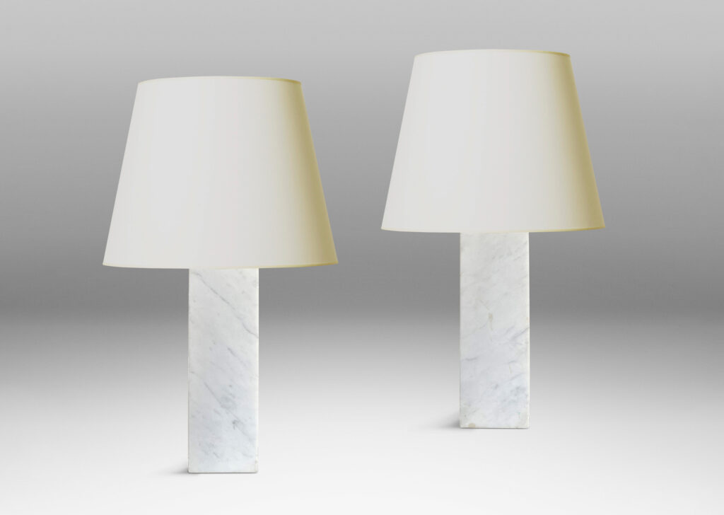 Gallery BAC muscular pedestal forms in solid white marble with light gray veining