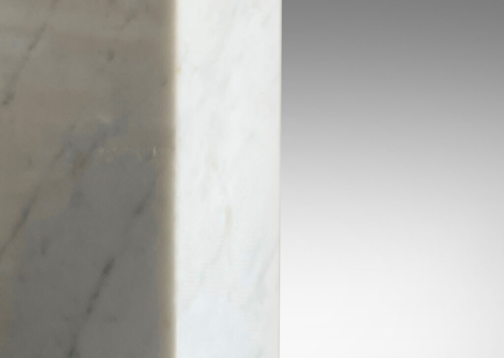 Gallery BAC muscular pedestal forms in solid white marble with light gray veining