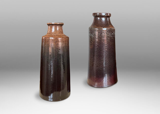 Gallery BAC tall raked bottle-like forms with flanged mouths in deep brown tones with fantastic constellations of speckling around their shoulders