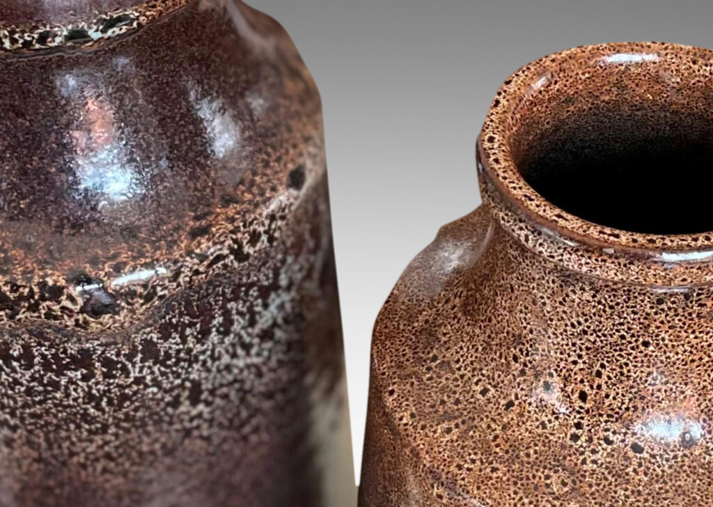 Gallery BAC tall raked bottle-like forms with flanged mouths in deep brown tones with fantastic constellations of speckling around their shoulders