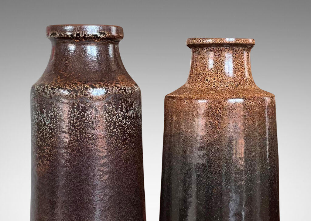 Gallery BAC tall raked bottle-like forms with flanged mouths in deep brown tones with fantastic constellations of speckling around their shoulders