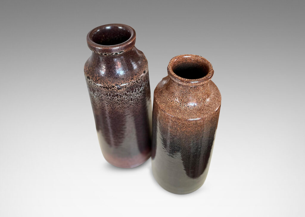 Gallery BAC tall raked bottle-like forms with flanged mouths in deep brown tones with fantastic constellations of speckling around their shoulders