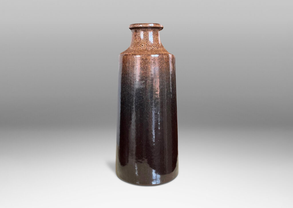 Gallery BAC tall raked bottle-like forms with flanged mouths in deep brown tones with fantastic constellations of speckling around their shoulders