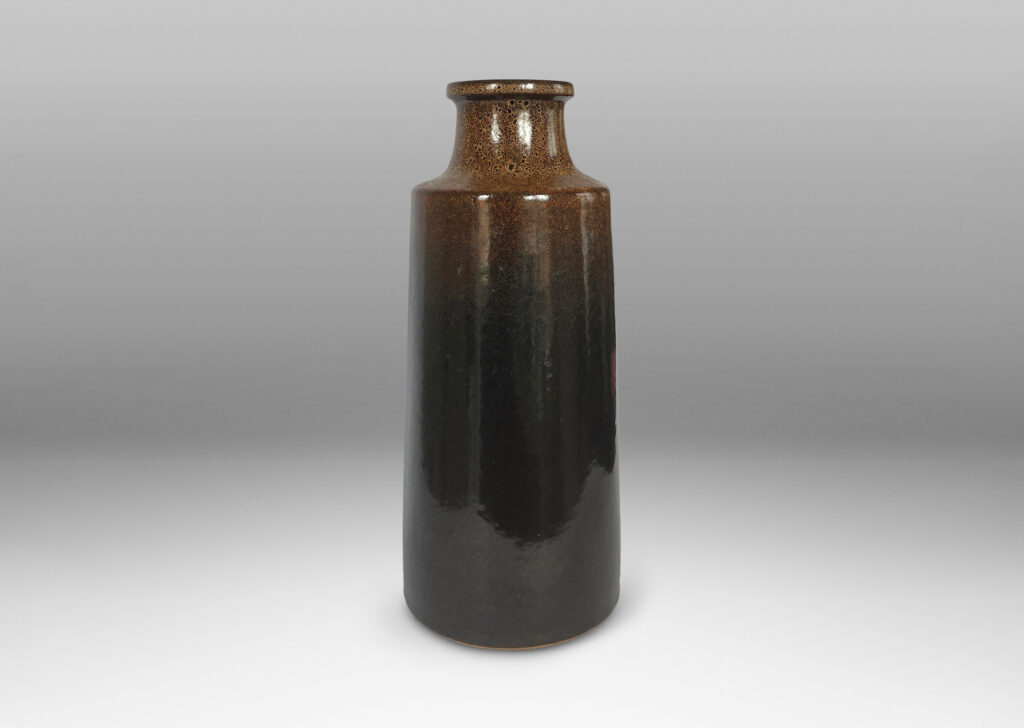 Gallery BAC tall raked bottle-like forms with flanged mouths in deep brown tones with fantastic constellations of speckling around their shoulders