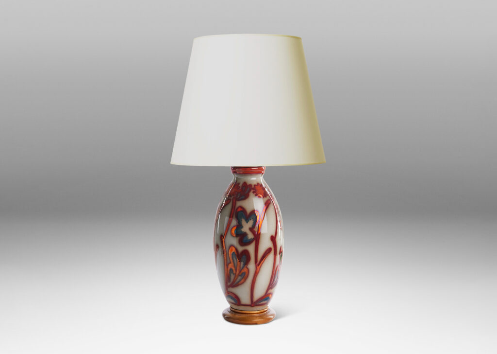 Gallery BAC swelling column form exuberantly painted with a stylized flora design in red luster on a pale gray field