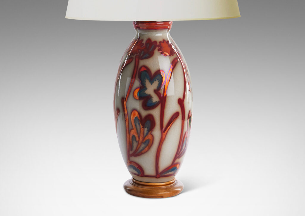 Gallery BAC swelling column form exuberantly painted with a stylized flora design in red luster on a pale gray field