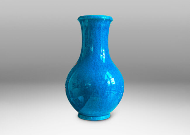 Gallery BAC crafted in earthenware with a saturated turquoise glaze with elegantly subtle craquelure texture