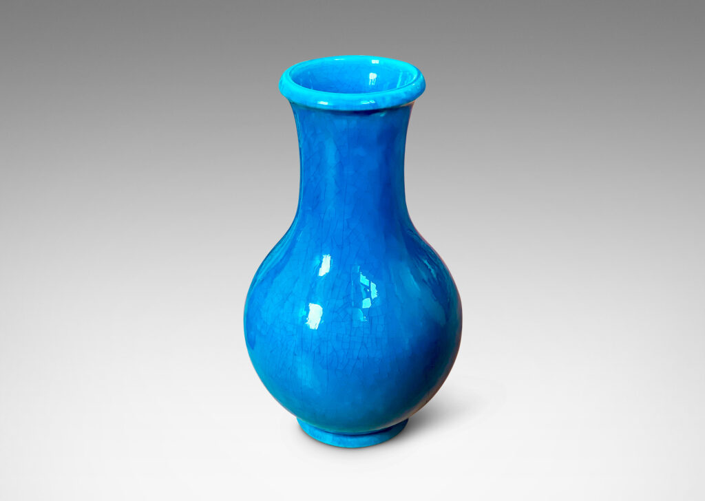 Gallery BAC crafted in earthenware with a saturated turquoise glaze with elegantly subtle craquelure texture