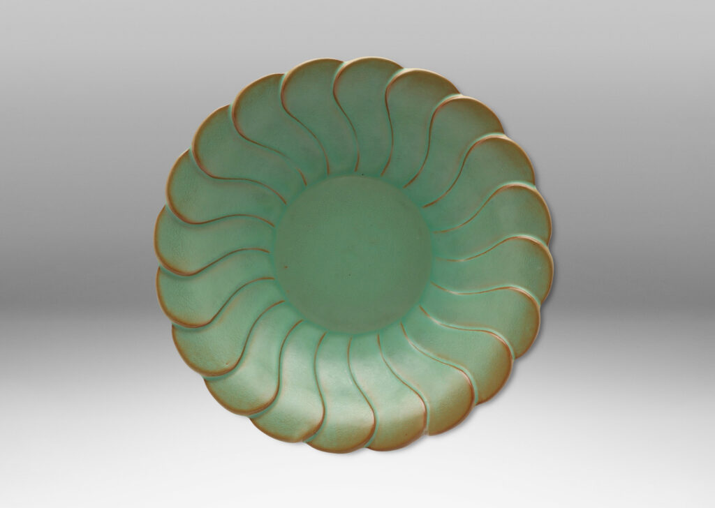 Gallery BAC relief pattern of overlapping scallops, vaguely evoking a flower, in a bright celadon with brown shading