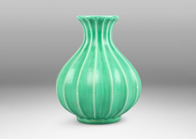 Gallery BAC fluted bulbous form with flared mouth in celadon glaze