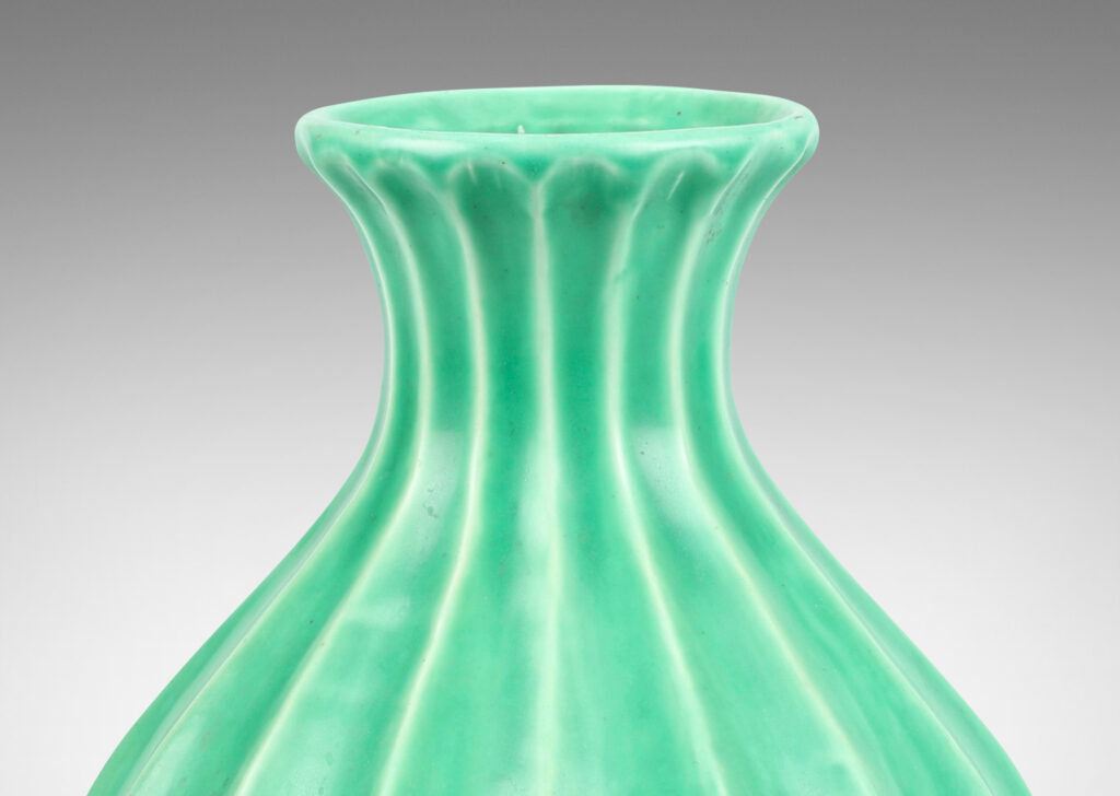 Gallery BAC fluted bulbous form with flared mouth in celadon glaze