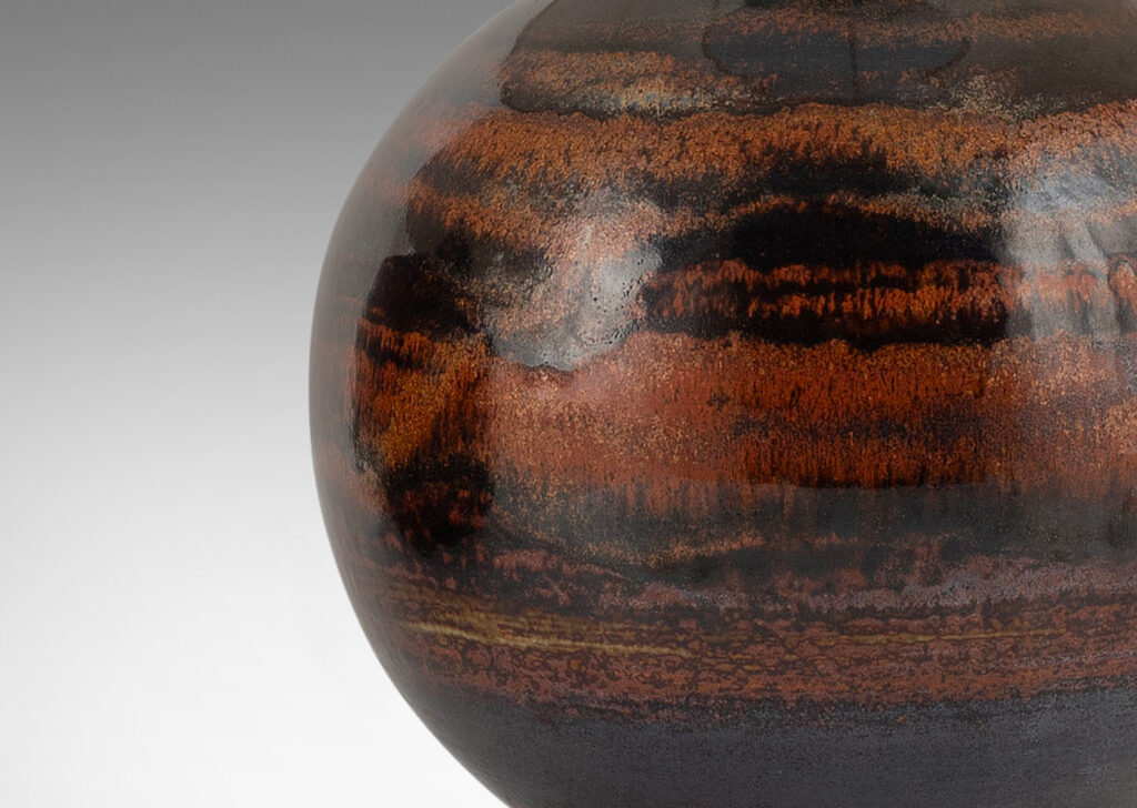 Gallery BAC plump globe forms in black and rust-red luster glaze