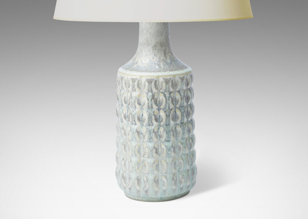 Gallery BAC bottle-like form with pillowy grid relief, glazed in a cool pale gray with warm gray circle pattern