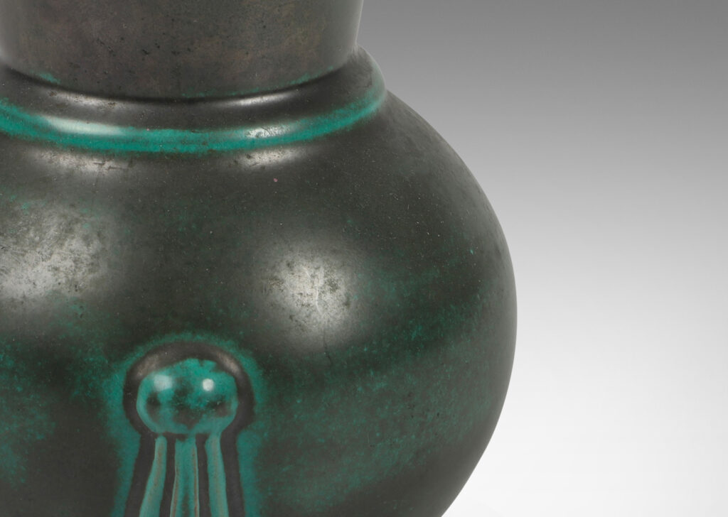 Gallery BAC carafe-like forms with flared necks and relief tassel “handles” in a deep blue-green copper oxide glaze