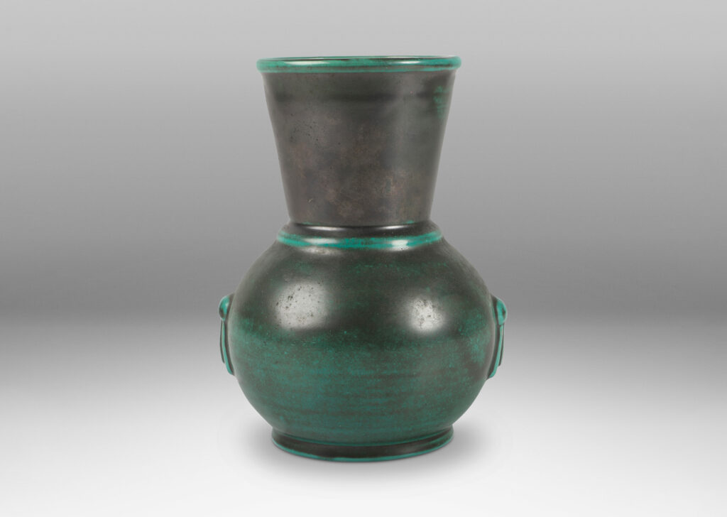 Gallery BAC carafe-like forms with flared necks and relief tassel “handles” in a deep blue-green copper oxide glaze