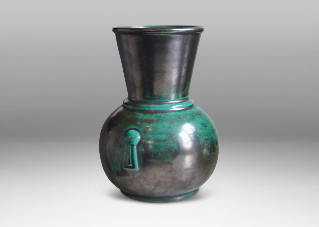 Gallery BAC carafe-like forms with flared necks and relief tassel “handles” in a deep blue-green copper oxide glaze