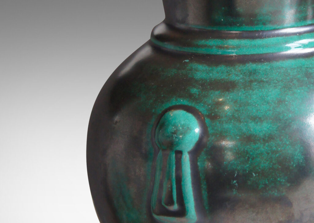 Gallery BAC carafe-like forms with flared necks and relief tassel “handles” in a deep blue-green copper oxide glaze