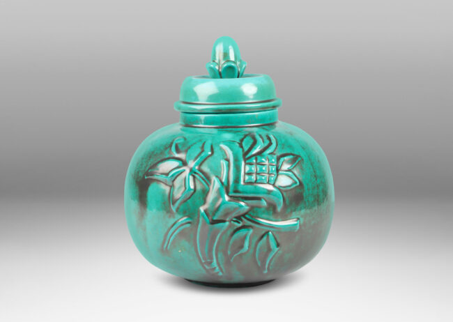 Gallery BAC wide globe form with a relief floral motif and acorn finial