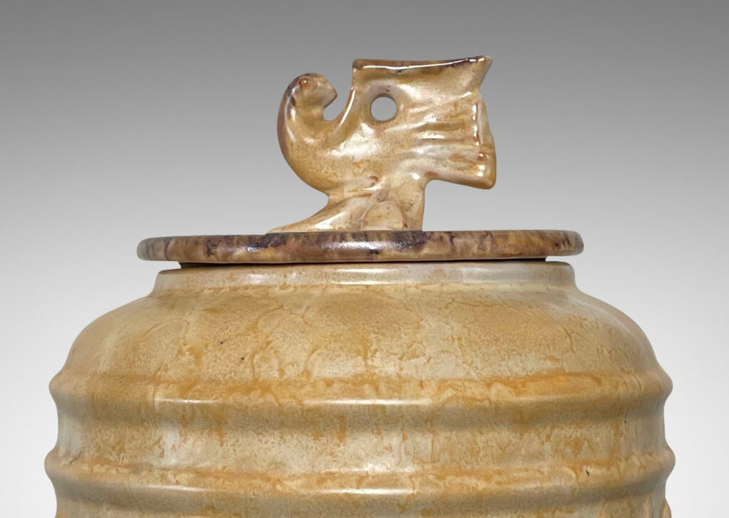 Gallery BAC reliefs of abstracted bird forms and bird finial, in earthenware with a sponged pale yellow