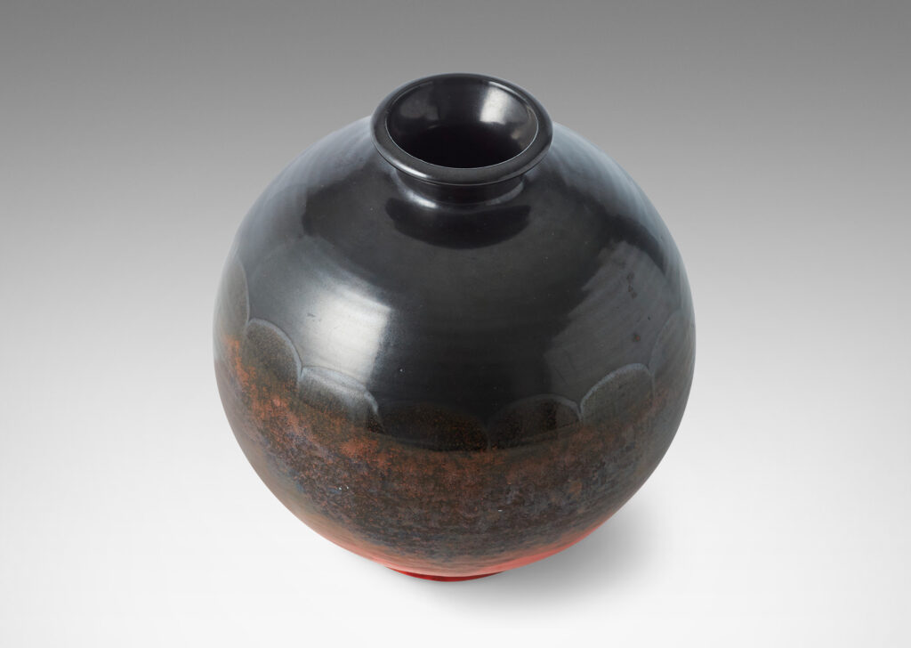 Gallery BAC wide globe form with flared reveal and neck, glazed in gunmetal luster and orange