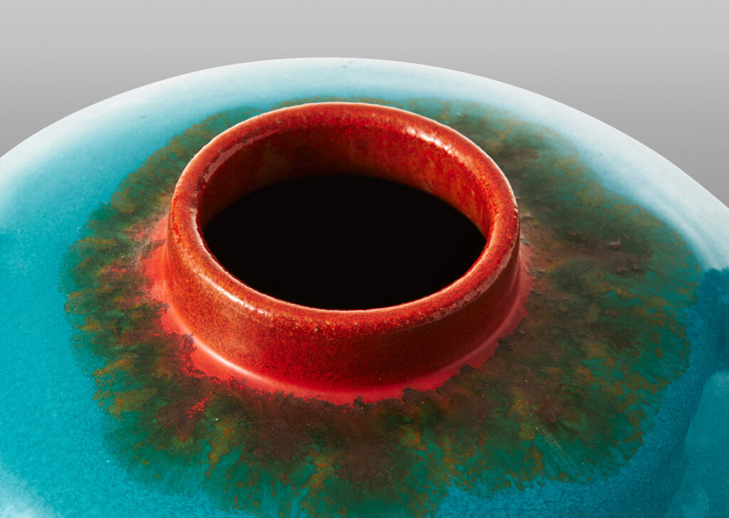 Gallery BAC wide globe form glazed in a saturated cerulean, with collar neck in a bright persimmon orange