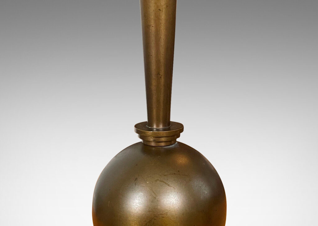 Gallery BAC tapered stand balanced on a sphere and disk base; patinated bronze