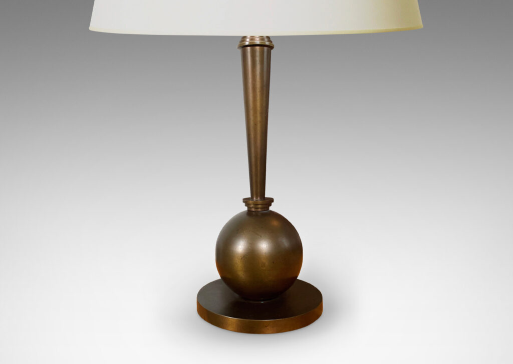 Gallery BAC tapered stand balanced on a sphere and disk base; patinated bronze