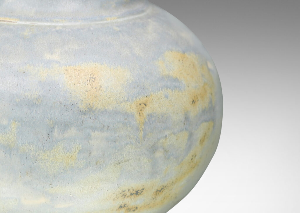 Gallery BAC compressed globe form with wide neck in hand-thrown stoneware with a magnificent blue-gray glaze with ochre dappling