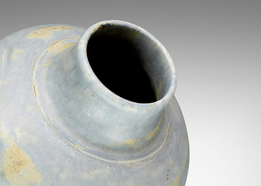 Gallery BAC compressed globe form with wide neck in hand-thrown stoneware with a magnificent blue-gray glaze with ochre dappling