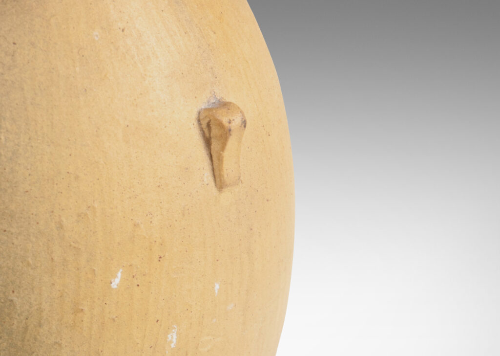 Gallery BAC ovoid form with carved texture, flared mouth, and small nodule-like handles