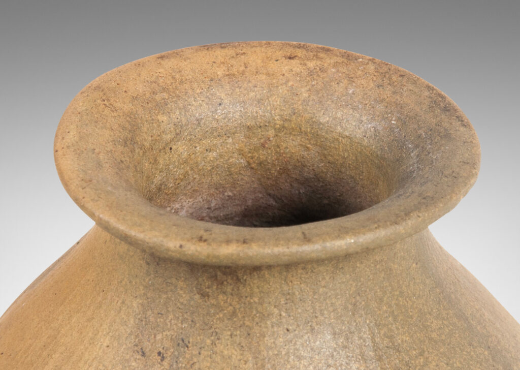 Gallery BAC ovoid form with carved texture, flared mouth, and small nodule-like handles